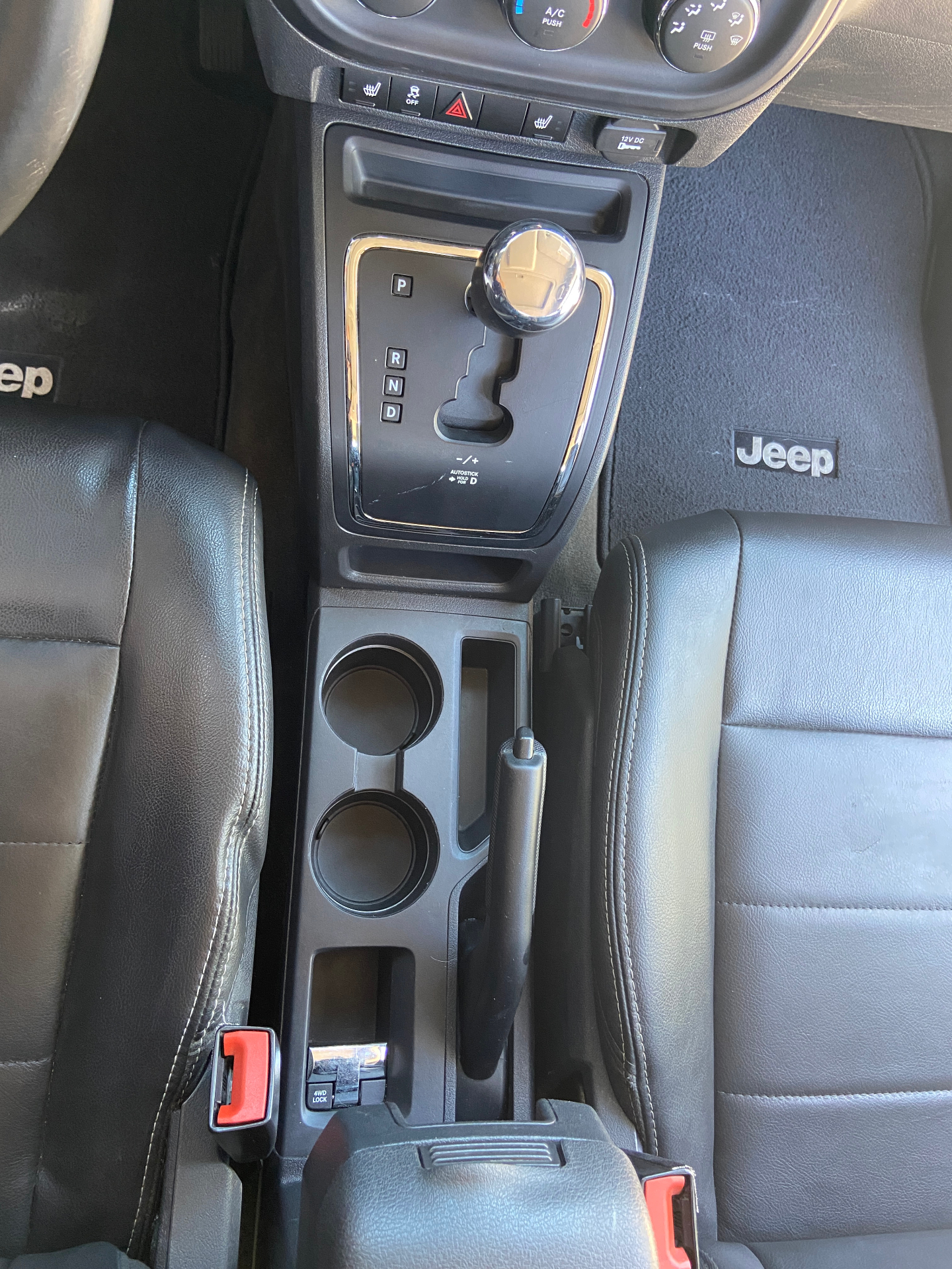 Jeep interior after detailing - spotless center console and clean cup holders