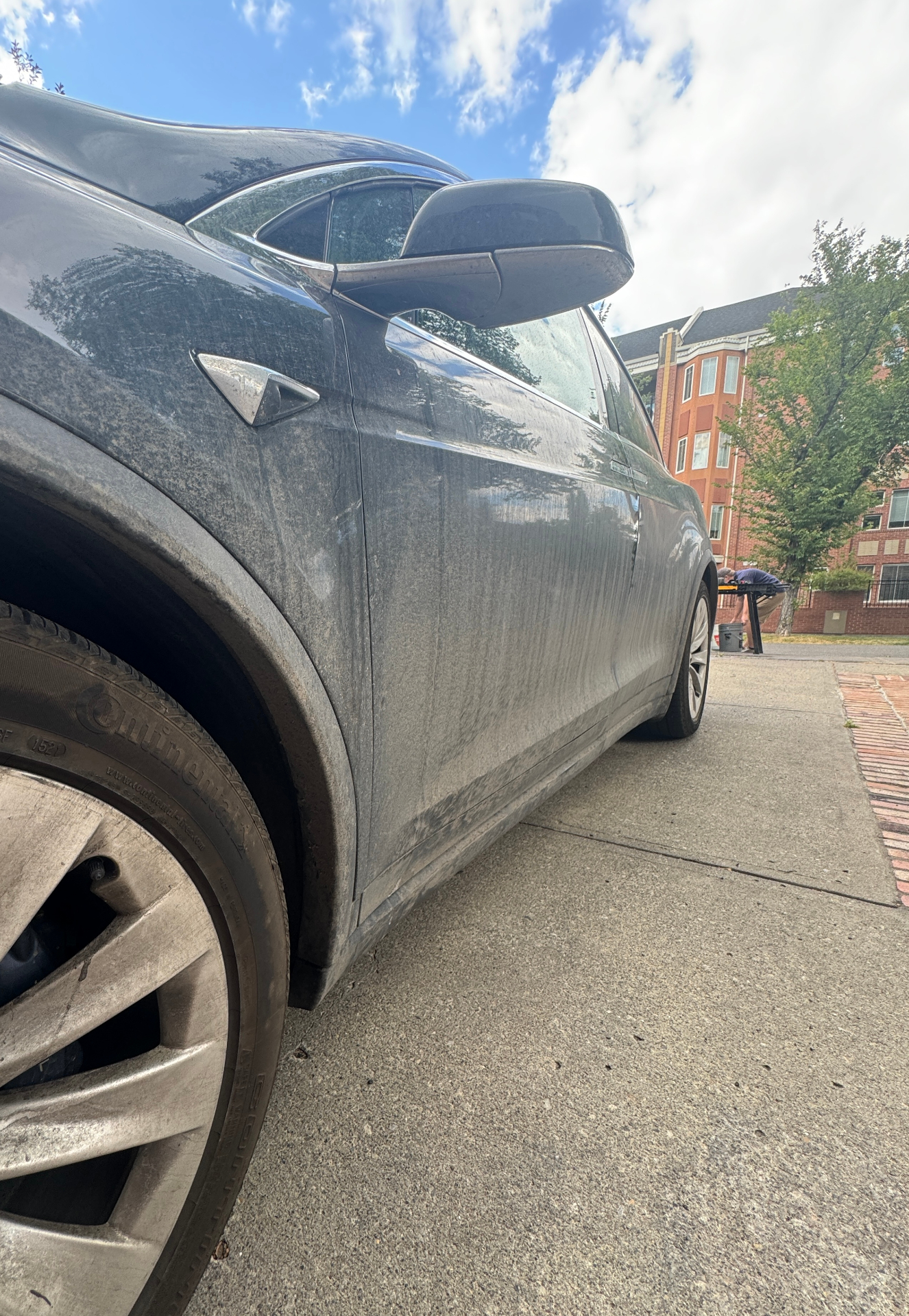 Tesla exterior before detailing - dirty and dusty surface